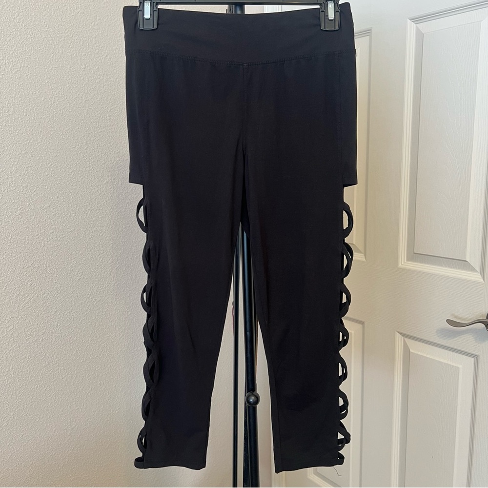 stylish black capri leggings with leg cut-outs